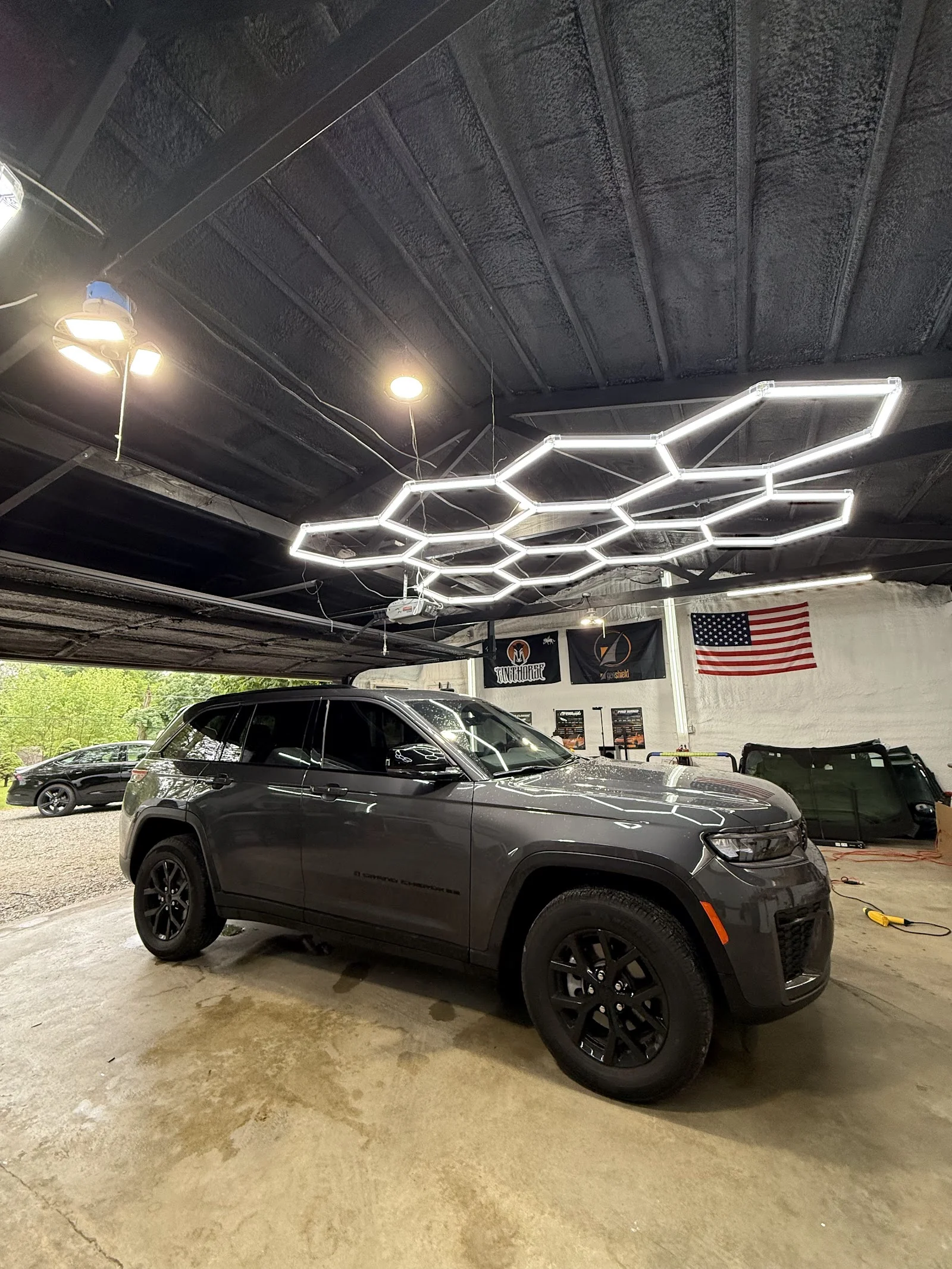 Inside Santos Window Tinting — shop interior and work bay